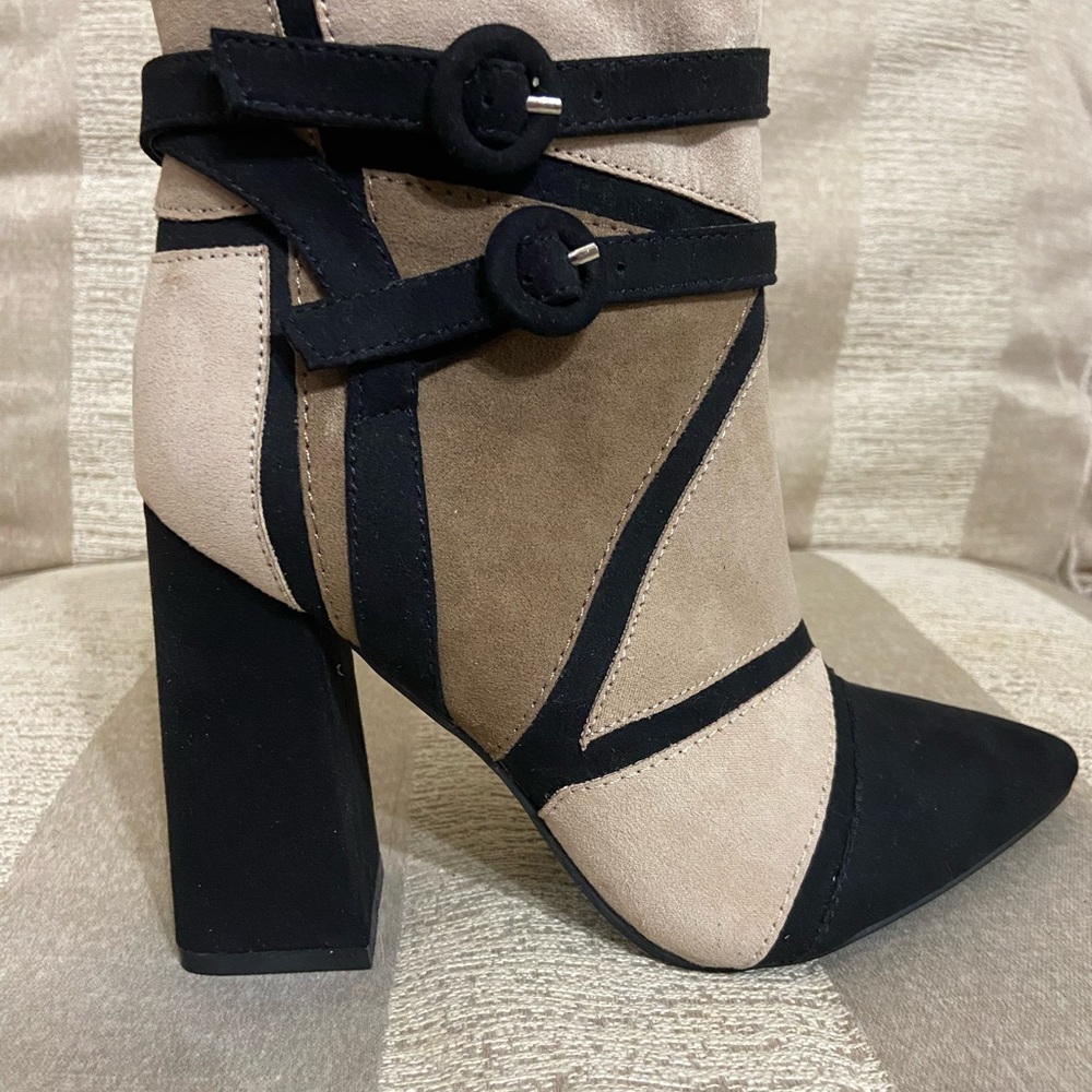 Stylish block heeled boots. New! Never worn. Sleek Design. Size 6.5.